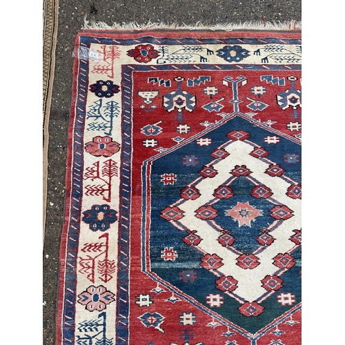 32 - 2 VINTAGE PATTERNED RUGS 
84 X 47