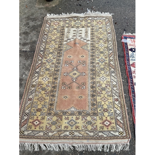 32 - 2 VINTAGE PATTERNED RUGS 
84 X 47