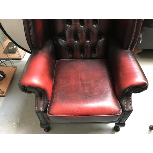 107 - OX BLOOD BUTTON BACKED CHESTERFIELD WING BACK ARMCHAIR ON CABRIOLE LEGS