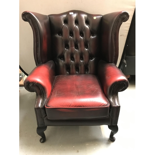 107 - OX BLOOD BUTTON BACKED CHESTERFIELD WING BACK ARMCHAIR ON CABRIOLE LEGS