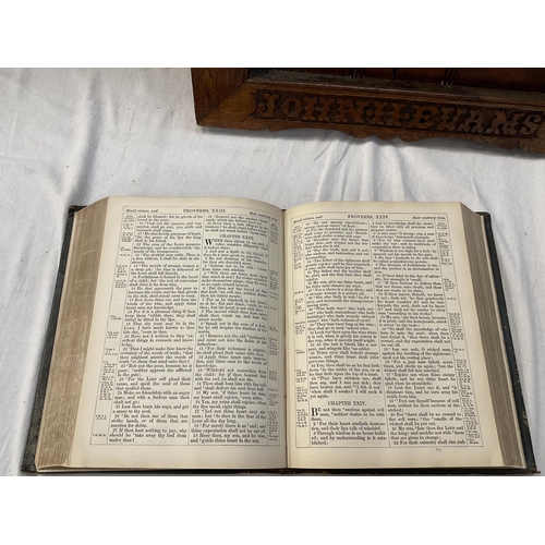 62 - EARLY BIBLE AND A CARVED HYMN NUMBER HOLDER (WORMED)