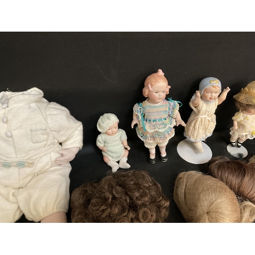 202 - BABYS CRIB AND VINTAGE DOLLS TO INCLUDE CHINA BODIED DOLLS ETC