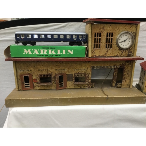 181 - VINTAGE MARKLIN TRAIN SET INCLUDING TRAINS, CARRIDGES, TRACK, TRANSFORMER AND BUILDINGS