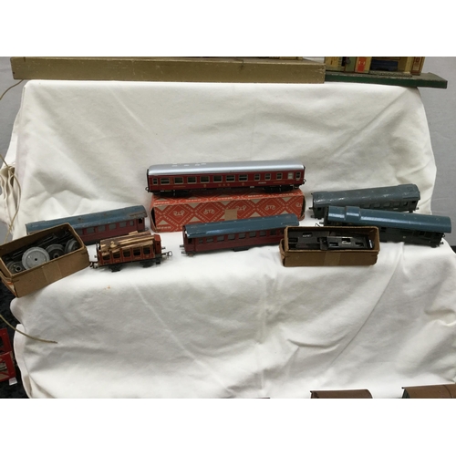 181 - VINTAGE MARKLIN TRAIN SET INCLUDING TRAINS, CARRIDGES, TRACK, TRANSFORMER AND BUILDINGS