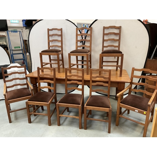 338 - LARGE HEAVY OAK DINING TABLE ON 4 TURNED LEGS WITH 8 MATCHING RAILBACK CHAIRS WITH UPHOLSTERED SEATS... 