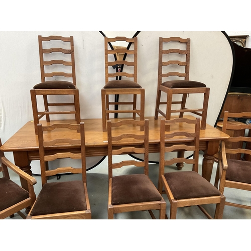 338 - LARGE HEAVY OAK DINING TABLE ON 4 TURNED LEGS WITH 8 MATCHING RAILBACK CHAIRS WITH UPHOLSTERED SEATS... 