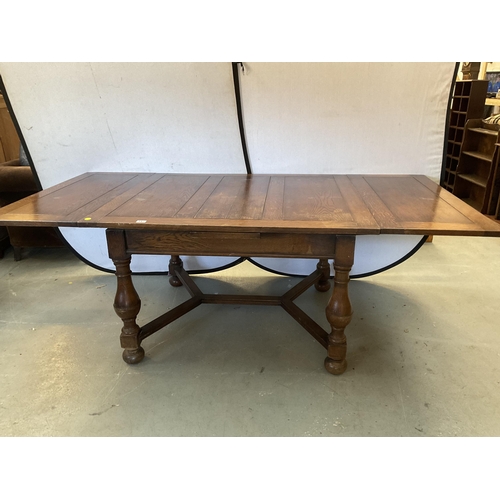 347 - VINTAGE OVER SIZED OAK STRETCHERED DRAWER LEAF DINING TABLE AND 8 MATCHING CHAIRS - H 30