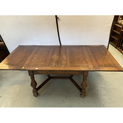 347 - VINTAGE OVER SIZED OAK STRETCHERED DRAWER LEAF DINING TABLE AND 8 MATCHING CHAIRS - H 30