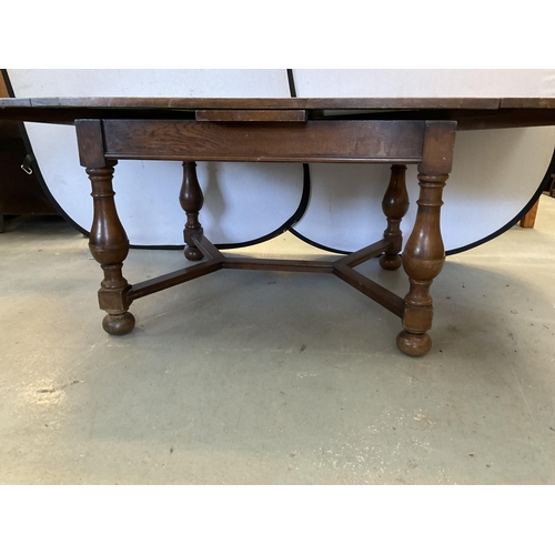 347 - VINTAGE OVER SIZED OAK STRETCHERED DRAWER LEAF DINING TABLE AND 8 MATCHING CHAIRS - H 30