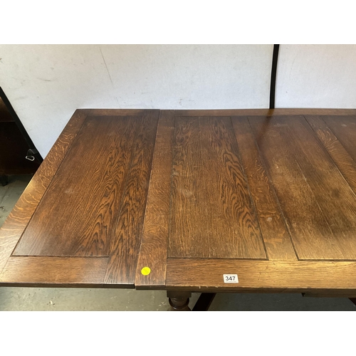 347 - VINTAGE OVER SIZED OAK STRETCHERED DRAWER LEAF DINING TABLE AND 8 MATCHING CHAIRS - H 30