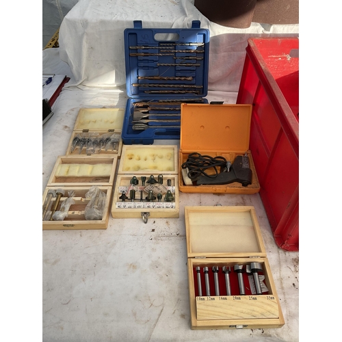 37 - CRATE OF TOOLS TO INCLUDE ROUTER BITS, BOXED PLANE, SANDING BELTS ETC