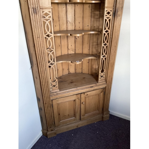 58 - LARGE WAXED PINE CORNER CABINET WITH CARVED OPEN TOP WITH 2 DOORS TO BASE H84