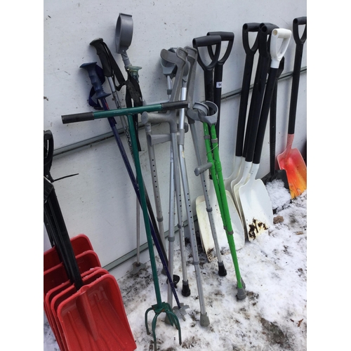 96 - QTY OF SNOW SHOVELS, WALKING STICKS ETC