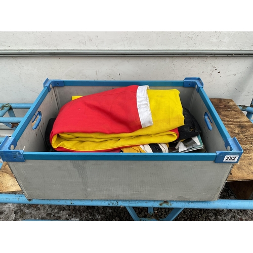 252 - CRATE OF FLAGS MILITARY HATS ETC