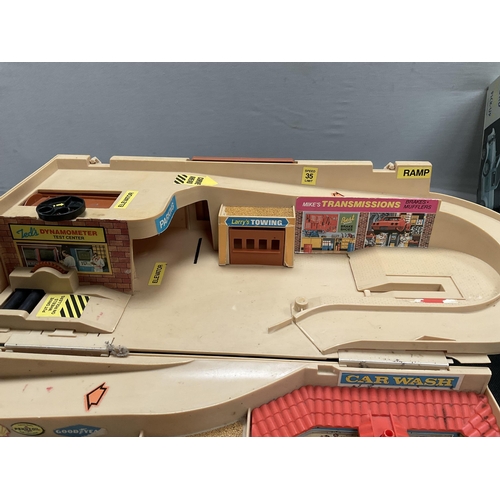 38 - HOTWHEELS SERVICE CENTER, BOXED MODEL KIT AND A FORD DIE CAST BOXED CAR