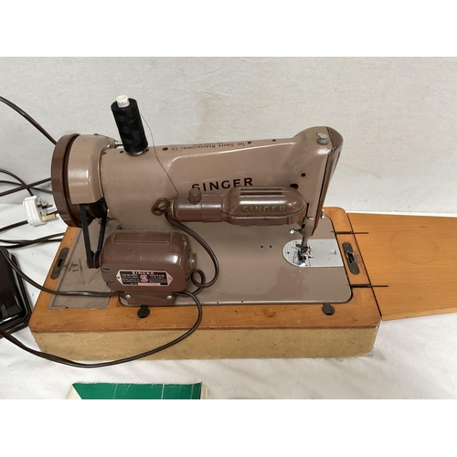 75 - CASED ELECTRIC SINGER SEWING MACHINE WITH INSTRUCTIONS & ACCESSORIES