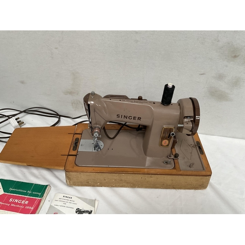 75 - CASED ELECTRIC SINGER SEWING MACHINE WITH INSTRUCTIONS & ACCESSORIES