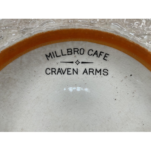 144 - 3 PIECES OF MILLBRO CAFE CRAVEN ARMS ADVERTISING CHINA ALONG WITH A LAPHROAIG WHISKY WATER JUG