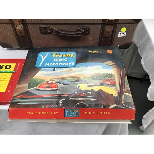 215 - SUITCASE OF VINTAGE TOYS TO INCLUDE TRIANG RAILWAY MINI MOTORWAY SET ETC