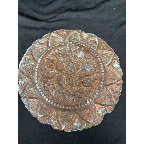 192 - ANTIQUE COPPER DISH WITH HAND RAISED DECORATION OF STYLISED FLOWERS DIA 10