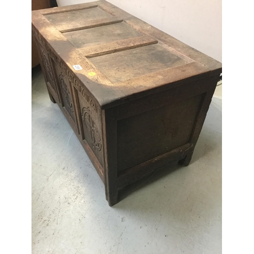 255 - ANTIQUE OAK COFFER WITH 3 PANEL LID AND CARVED FRONT A/F  H25