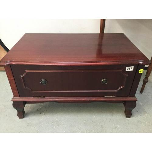 257 - REPRODUCTION MAHOGANY TV STAND WITH FOLD FRONT CUPBOARD BELOW H17