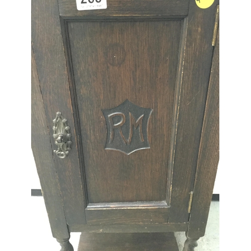 263 - VINTAGE OAK BEDSIDE CABINET WITH FITTED INTERIOR ON BARLEY TWIST LEGS WITH CARVED INITIALS TO THE DO... 