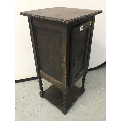 263 - VINTAGE OAK BEDSIDE CABINET WITH FITTED INTERIOR ON BARLEY TWIST LEGS WITH CARVED INITIALS TO THE DO... 