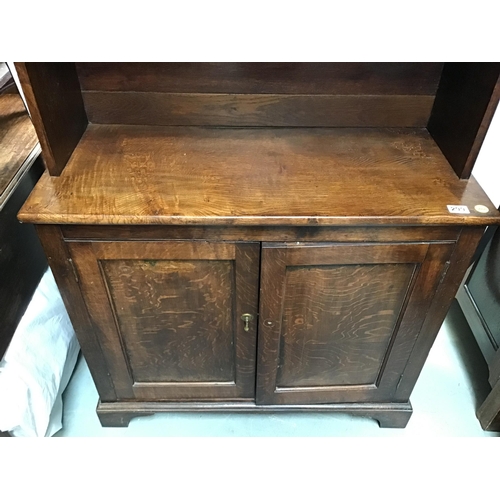 299 - SMALL OAK DRESSER WITH CUPBOARD BASE AND 3 SHELVES ABOVE A/F  - REAR FOOT NEEDS REFIXING H73