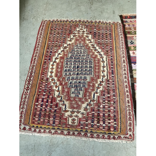 387 - 3 VINTAGE HAND MADE WOOLEN RUGS
61