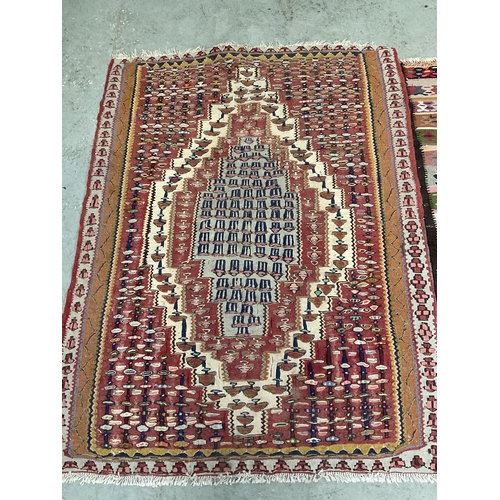 387 - 3 VINTAGE HAND MADE WOOLEN RUGS
61