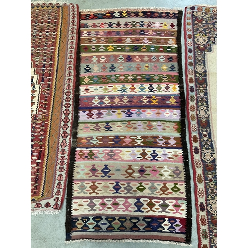 387 - 3 VINTAGE HAND MADE WOOLEN RUGS
61