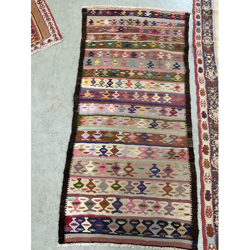 387 - 3 VINTAGE HAND MADE WOOLEN RUGS
61