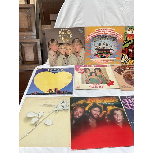 398 - BOX OF RECORDS AND LP'S TO INCLUDE BEACH BOYS BUCKS FIZZ, BEE GEES ETC