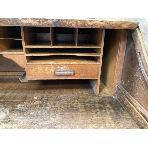 399 - VINTAGE OAK ROLL TOP KNEE HOLE TWIN PEDASTAL DESK WITH FITTED INTERIOR AND WORK SLIDE