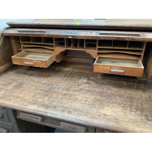 399 - VINTAGE OAK ROLL TOP KNEE HOLE TWIN PEDASTAL DESK WITH FITTED INTERIOR AND WORK SLIDE