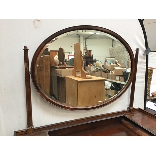 317 - EDWARDIAN MAHOGANY DRESSING TABLE FITTED WITH 6 DRAWERS ON FLUTED LEGS WITH OVAL MIRROR ABOVE H64