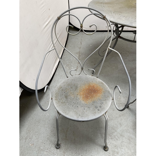 406 - METAL PAINTED GARDEN/PATIO TABLE AND 4 CHAIRS WITH DECORATIVE BACKS A/F