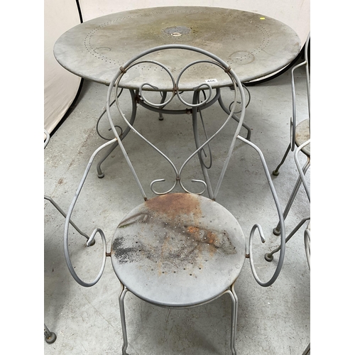 406 - METAL PAINTED GARDEN/PATIO TABLE AND 4 CHAIRS WITH DECORATIVE BACKS A/F