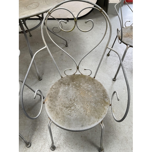 406 - METAL PAINTED GARDEN/PATIO TABLE AND 4 CHAIRS WITH DECORATIVE BACKS A/F