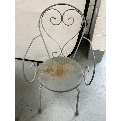 406 - METAL PAINTED GARDEN/PATIO TABLE AND 4 CHAIRS WITH DECORATIVE BACKS A/F