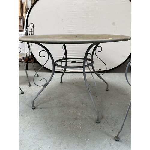 406 - METAL PAINTED GARDEN/PATIO TABLE AND 4 CHAIRS WITH DECORATIVE BACKS A/F