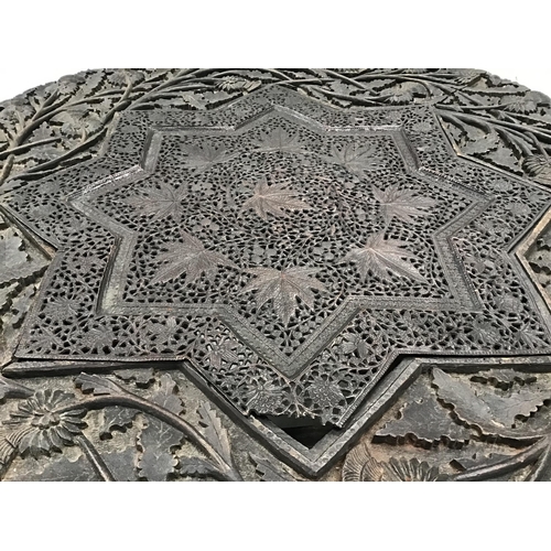 329 - EARLY INDIAN CARVED FOLDING TABLE WITH METAL FRETWORK PANEL IN TOP A/F