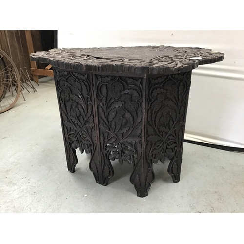 329 - EARLY INDIAN CARVED FOLDING TABLE WITH METAL FRETWORK PANEL IN TOP A/F