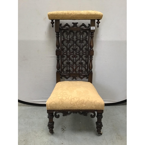 332 - ANTIQUE MAHOGANY ORNATLEY CARVED PRAYER CHAIR WITH UPHOLSTERED SEAT AND BACK RAIL H40