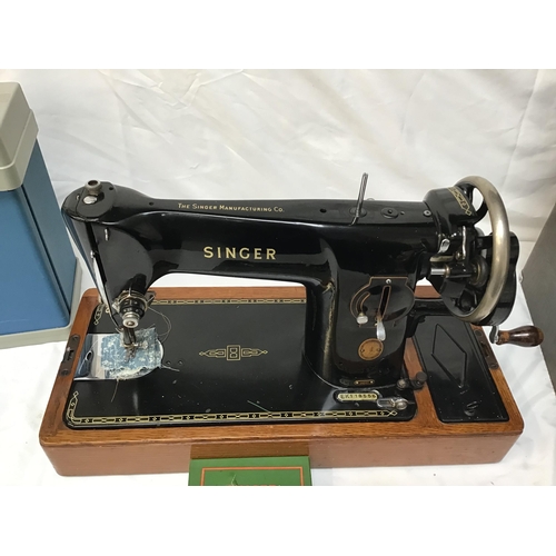 335 - TABLE TOP SINGER SEWING MACHINE CASED AND A BOX FILE