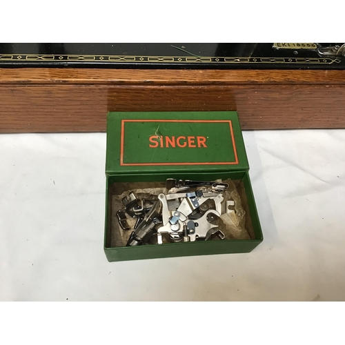 335 - TABLE TOP SINGER SEWING MACHINE CASED AND A BOX FILE