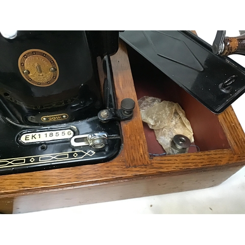 335 - TABLE TOP SINGER SEWING MACHINE CASED AND A BOX FILE