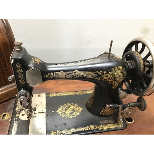 341 - VINTAGE TREADLE SINGER SEWING MACHINE WITH CAST IRON BASE AND FITTED DRAWERS