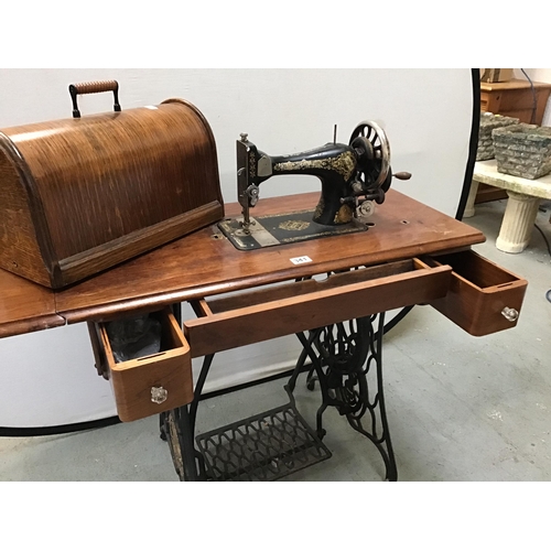 341 - VINTAGE TREADLE SINGER SEWING MACHINE WITH CAST IRON BASE AND FITTED DRAWERS